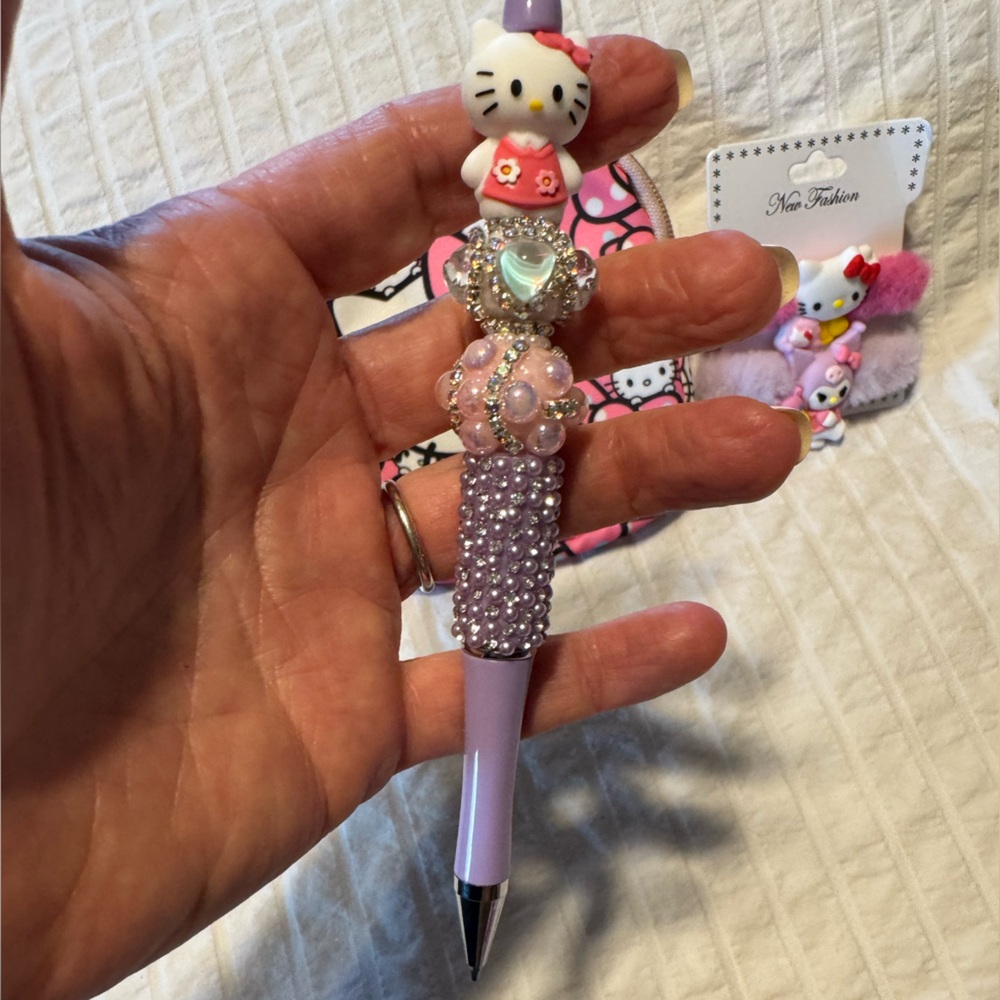 Sanrio-Hello Kitty Bundle With Pink Pouch, 2 Hair Ties, & Pen 3-Piece Set - Picture 2 of 9